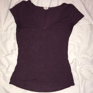 tight purple garage shirt